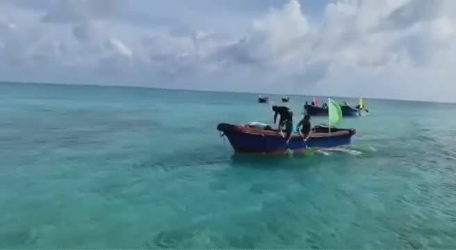 来自祖国最南端的海域,渔民他们在赛龙舟...